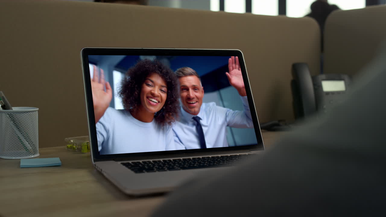 Colleagues greeting web camera laptop at online conference close up. Video call
