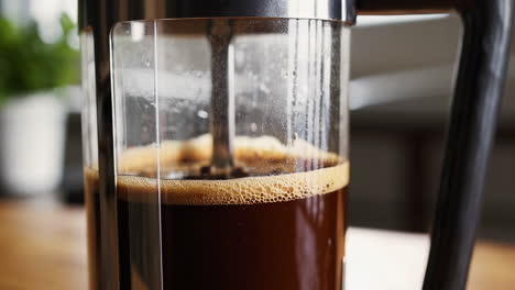close-up of coffee brewing in a french press