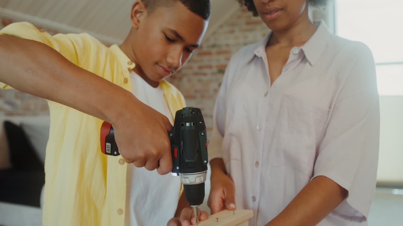 Mother and son working on a home improvement project together