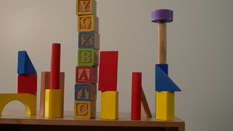 wooden toy blocks in tower ready to play with cubes and wooden pieces