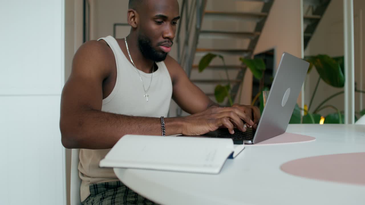 Man Working on Laptop at Home
