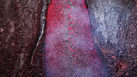 Flowing lava on Mount Etna in Sicily, showcasing volcanic landscape