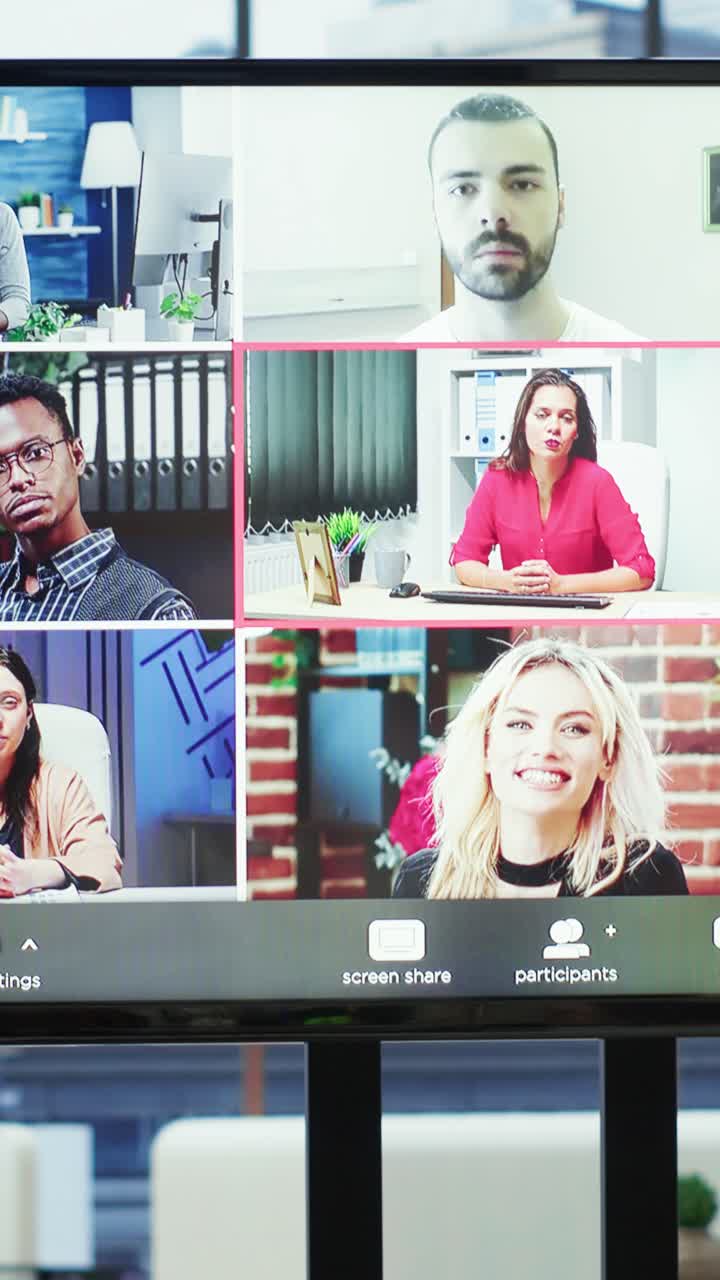 Vertical Video Diverse team of workers reviewing project updates together with shareholders