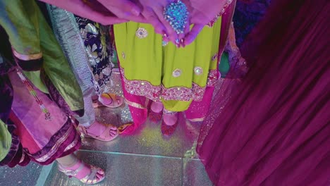 A-close-up-of-the-bride's-hand-showing-off-her-silver-bangle's-and-enormous-traditional-ring