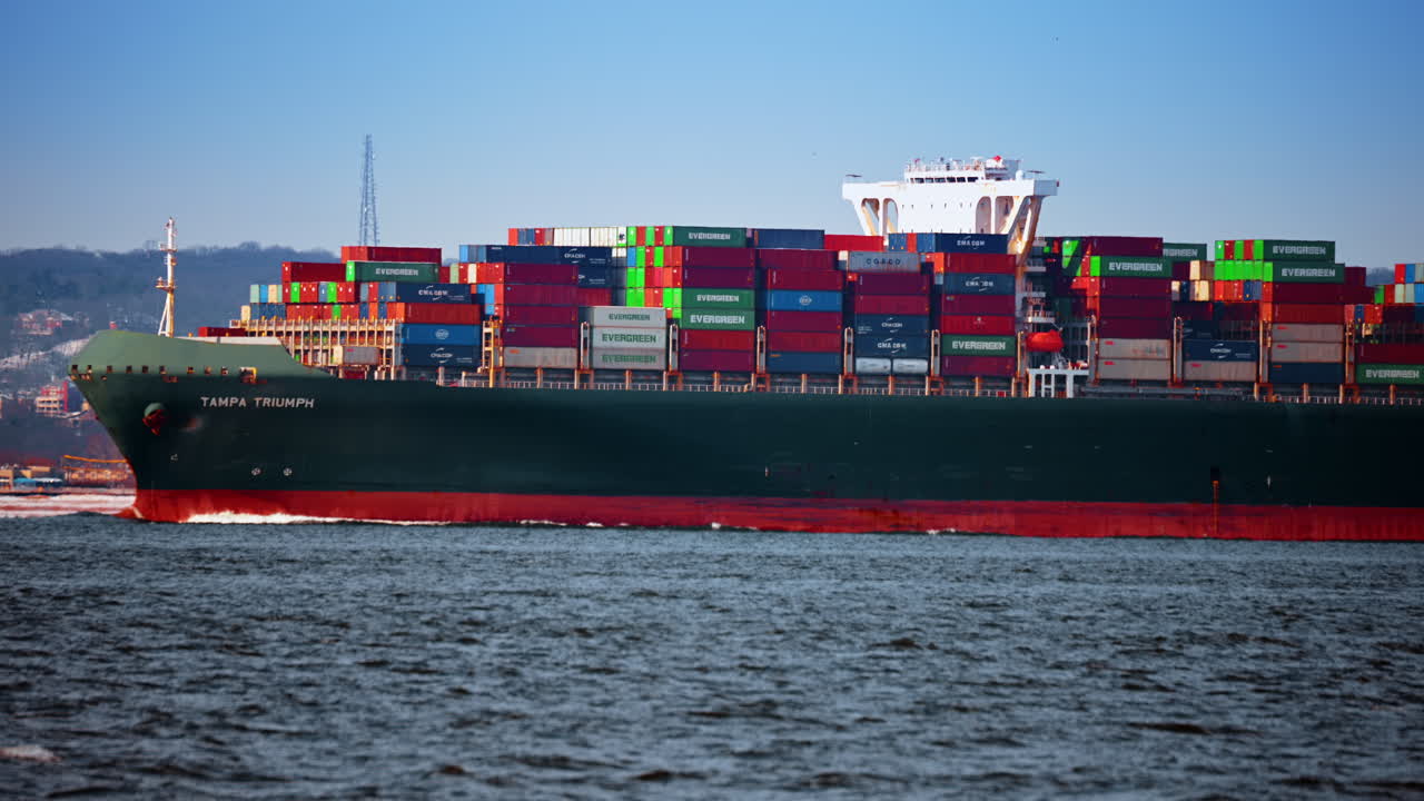 New York, USA, 28 December 2025: Evergreen container ship near New York. Evergreen container ship sailing through New York Harbor on a clear day