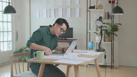 asian man works with laptop computer and storyboard. stand up and walking out frame, comics compilation, application ui or game plot