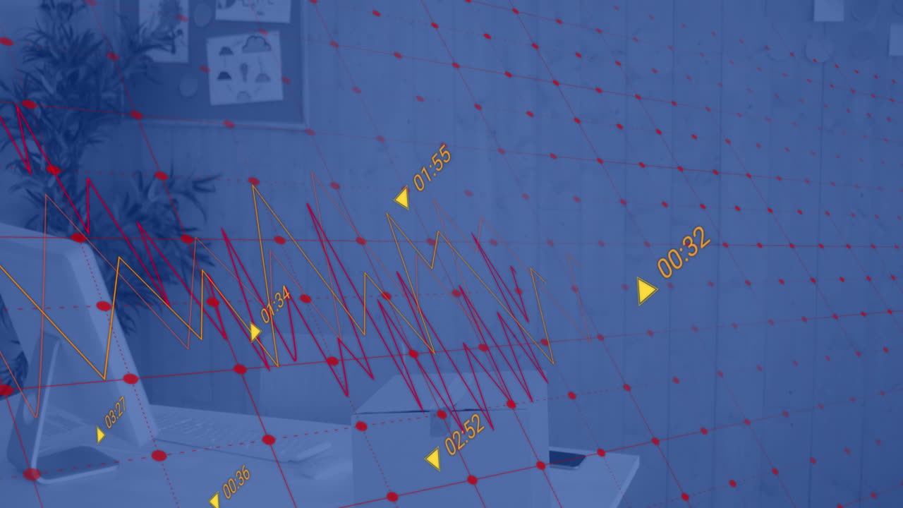 그래프와 데이터를 처리하는 컴퓨터는 빈 사무실에서 책상에 있습니다.