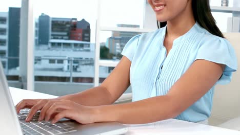 Businesswoman-working-on-her-laptop