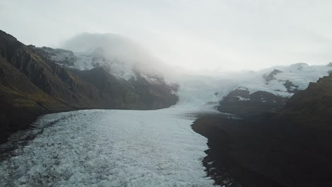 morning fog over icelanding glacier aerial