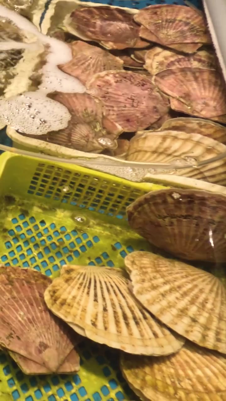 Various seafood sizzling on a barbecue grill
