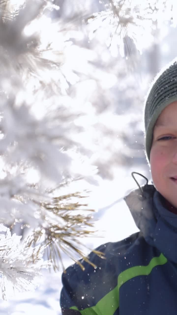 Child joyfully playing in snowy landscape, surrounded by sparkling snowflakes and winter trees, capturing the essence of winter fun and excitement