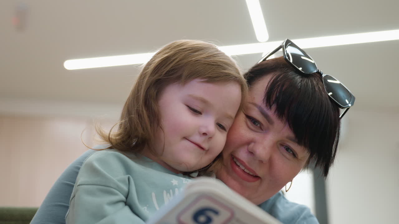 Child repeating after mentor with close face contact, soft indoor light, calm coaching tone, lips forming words, attentive gaze, gentle pronunciation practice, learning moment, focused connection