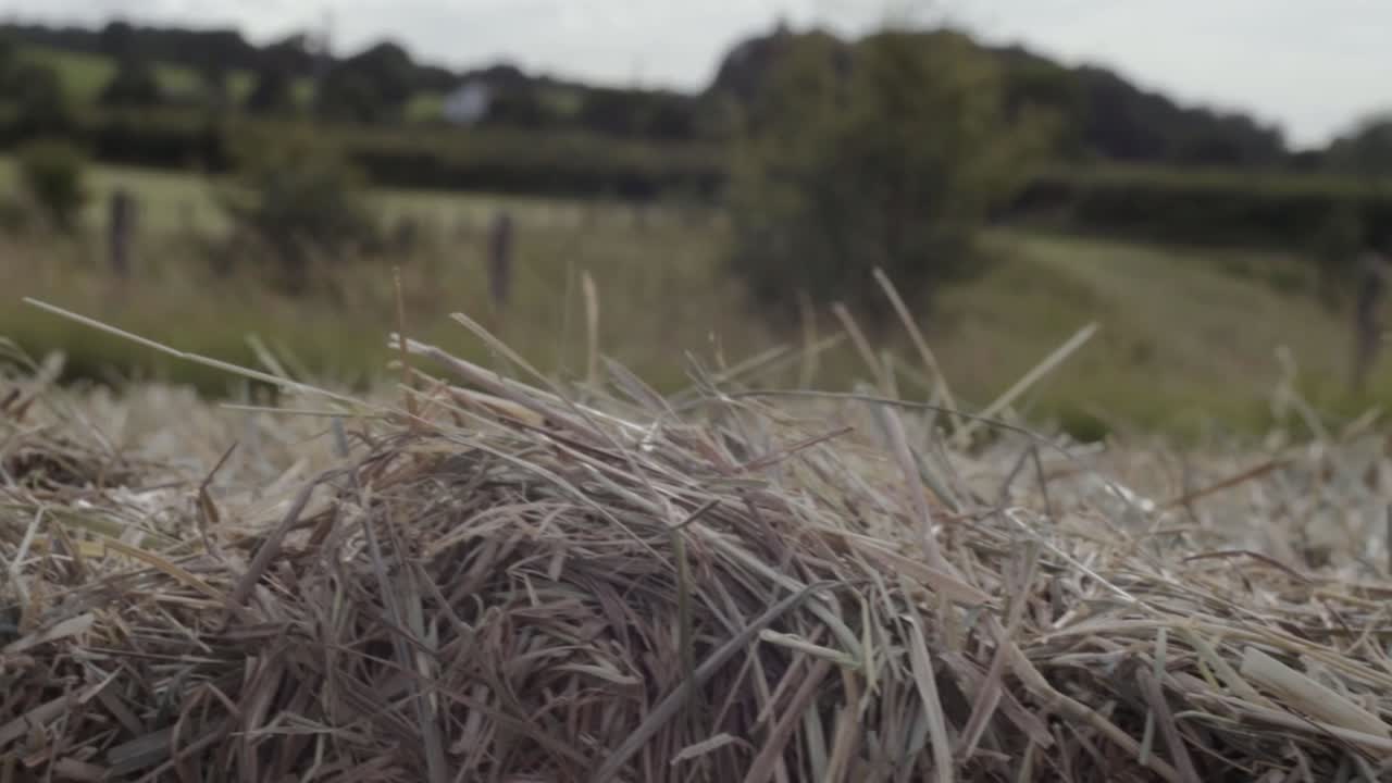 Hay bales in farmers field close up crane shot