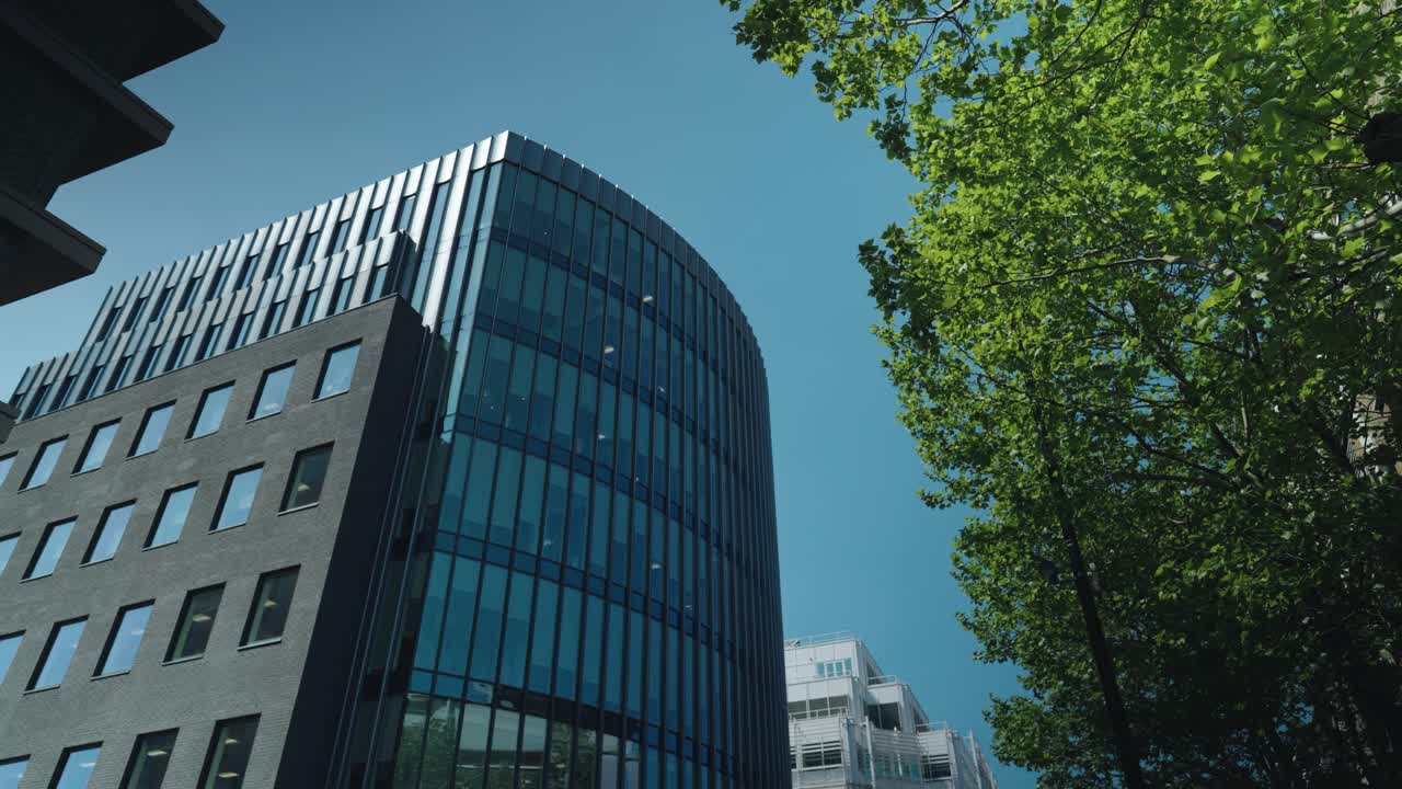Glass architecture commercial buildings in frame of London, UK