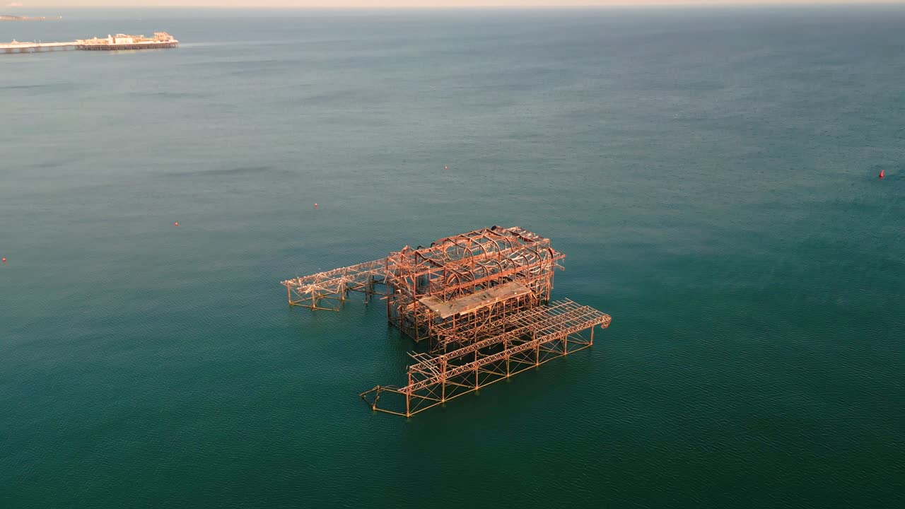 Aerial View of Brighton West Pier Isolated in Calm Sea at Sunset reflections