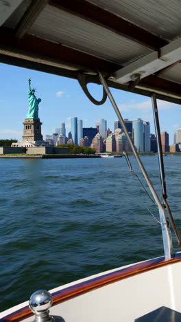 statue of liberty and nyc skyline from a boat tour