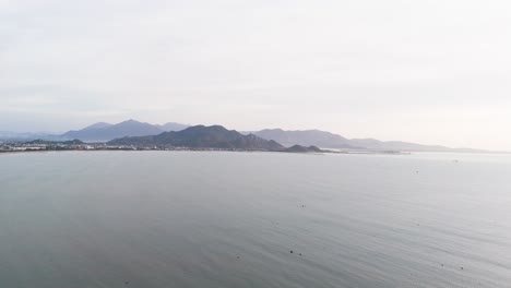 aerial view pan of the coast and the mountains in phan rang–tháp chàm in the morning.
