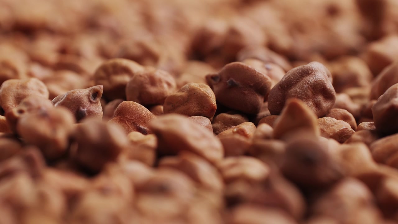 Close-up of Brown Chickpeas Falling