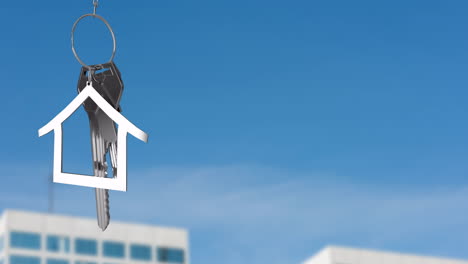 animation of silver house key and jey fob over cityscape