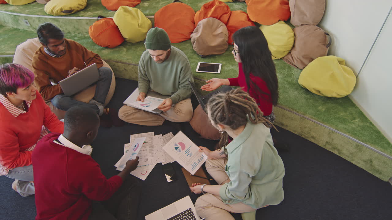 Start-Up Workers Discussing Financial Documents