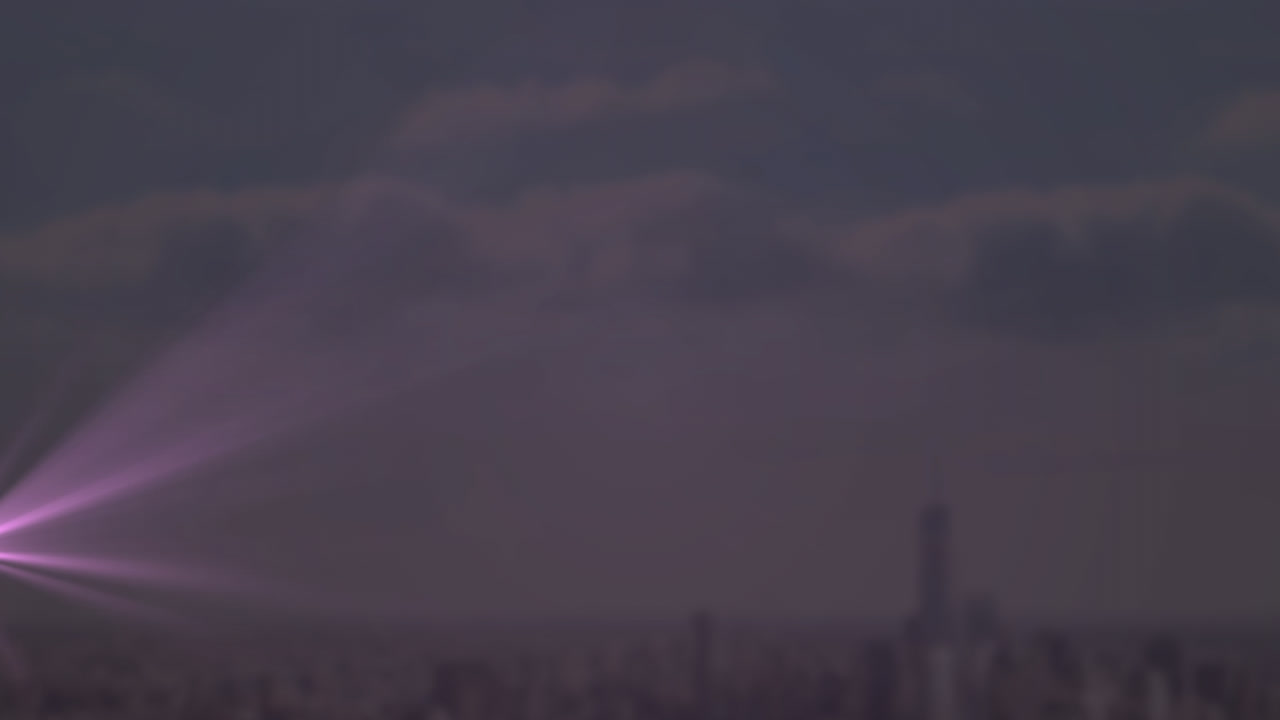 Animation of light trails over cityscape and sky