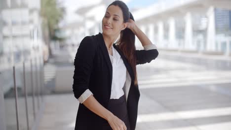 Elegant-businesswoman-standing-waiting