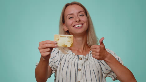 happy woman show plastic credit bank card advertising transferring money cashless, online shopping