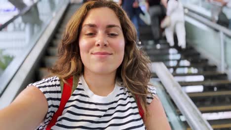 young female traveler filming while moving down. slow motion