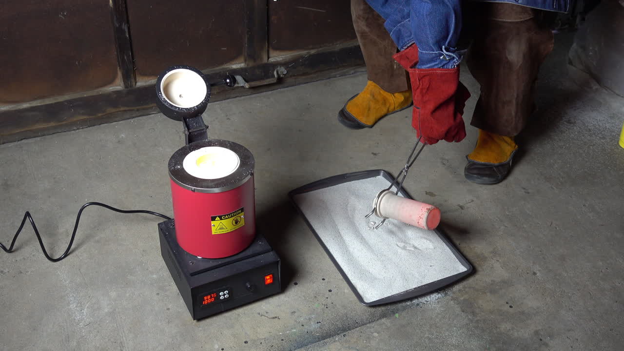 Crucible is treated with borax and replaced in furnace