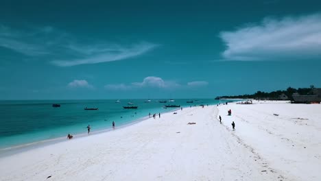 gorgeous aerial flight fly forwards drone shot over white sand beach and crystal clear turquoise water