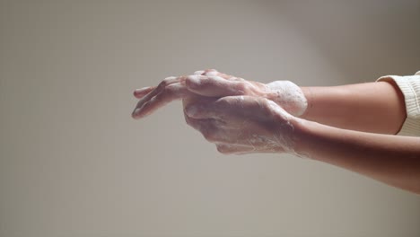 person washing his hands carefully with soap, personal hygiene