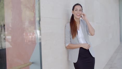 happy relaxed young woman chatting on her mobile