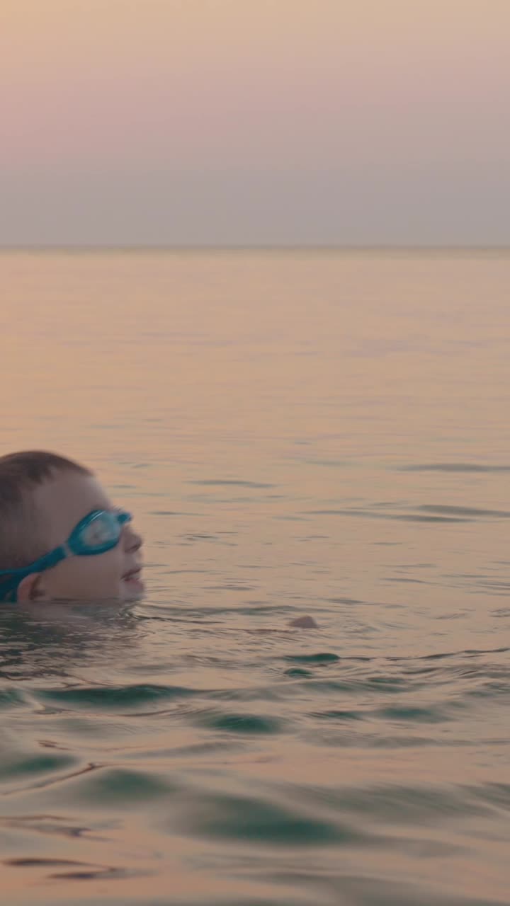 Mother and Child Bonding in the Ocean at Sunset