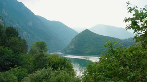 river drina and lake perućac through serbian mountainside, aerial view