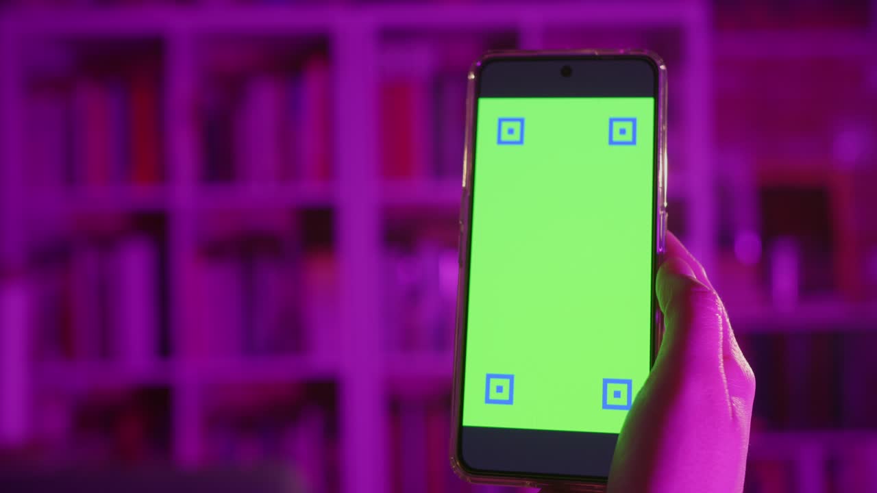 Hand Holding Smartphone with Green Screen and Tracking Markers
