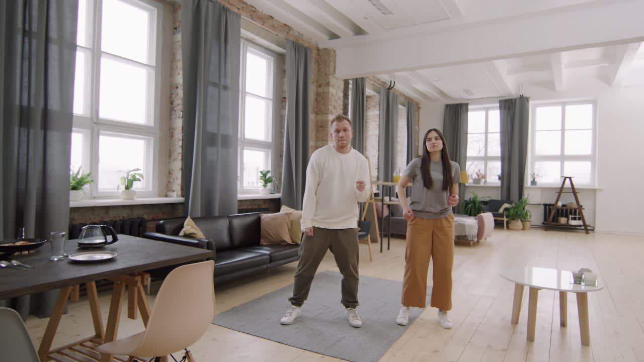 Happy Couple Dancing before Camera