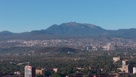 drone footage of southern mexico city mountains on a clear morning
