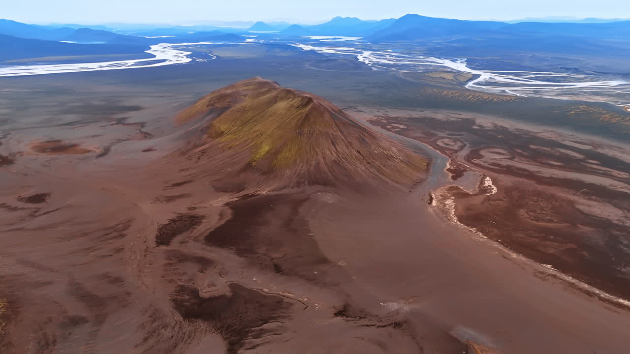 Stunning rocky landscape crossed by narrow rivers. Iceland scenery with no vegetation from aerial perspective.