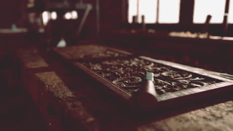 intricate wood carving in a traditional workshop