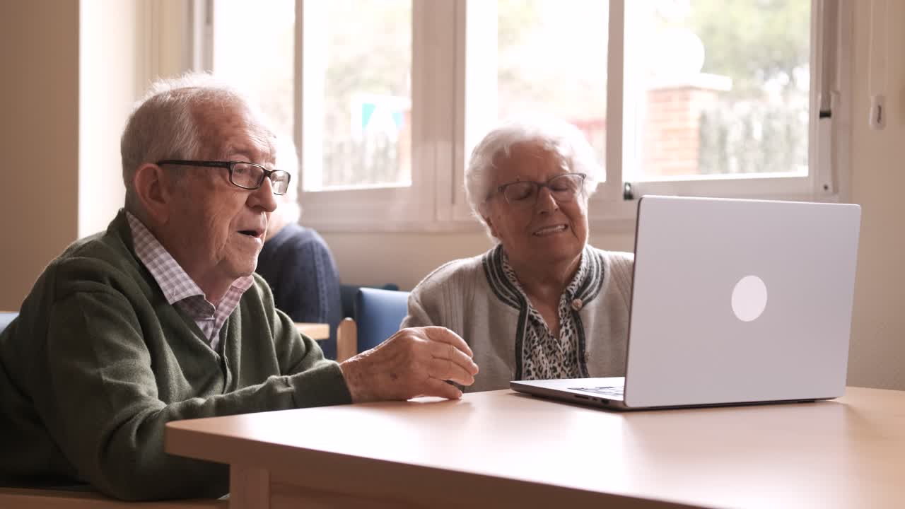Senior couple sending air kiss during video call