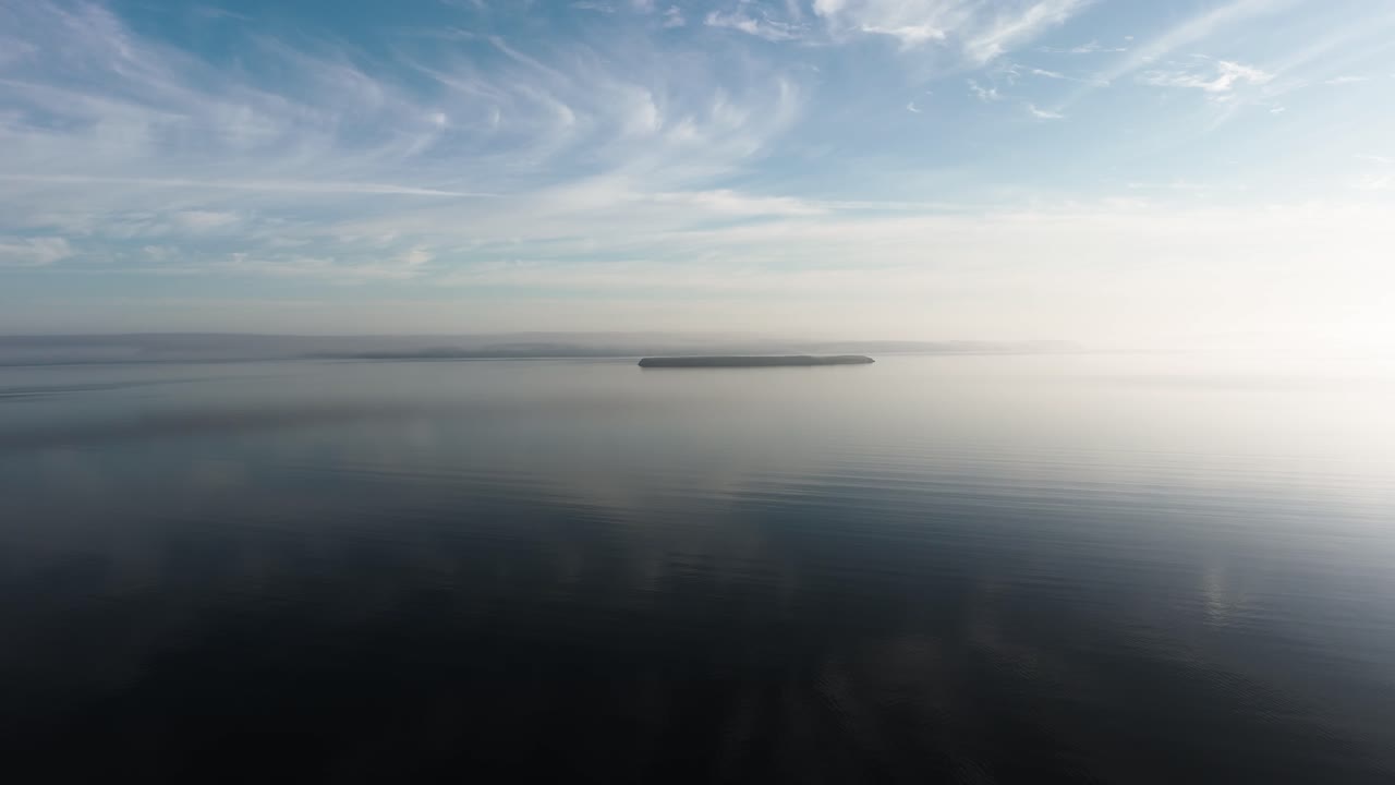 Newfoundland coast with Bell island on the back in calm early morning in the North Atlantic Ocean in Canada