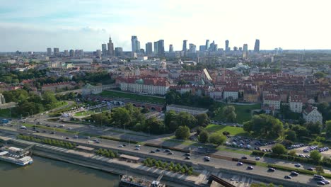 Aerial-panorama-of-Warsaw,-Poland-over-the-Vistual-river-and-City-center-in-a-distance-Old-town