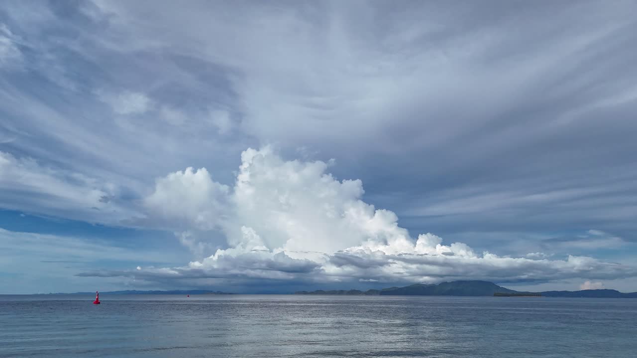 Dramatic Cloudscape Over Calm Ocean with Islands and Ships
