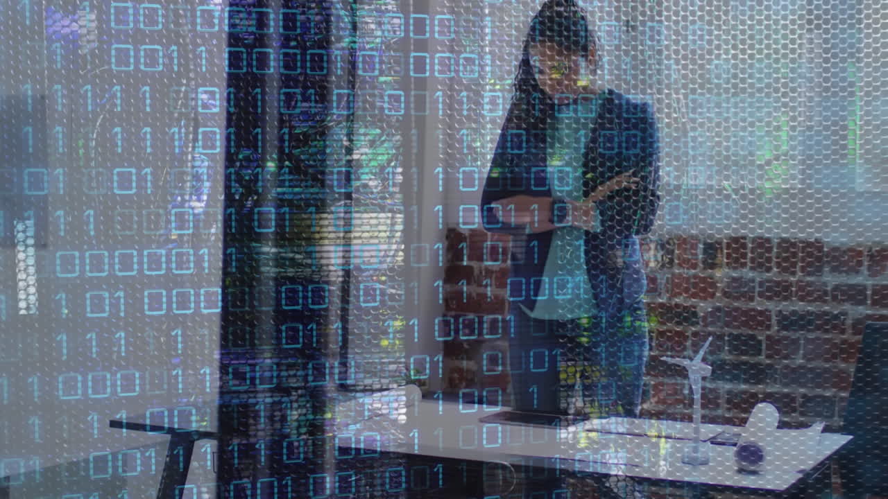 A biracial female business creative working in a modern office using a digital tablet