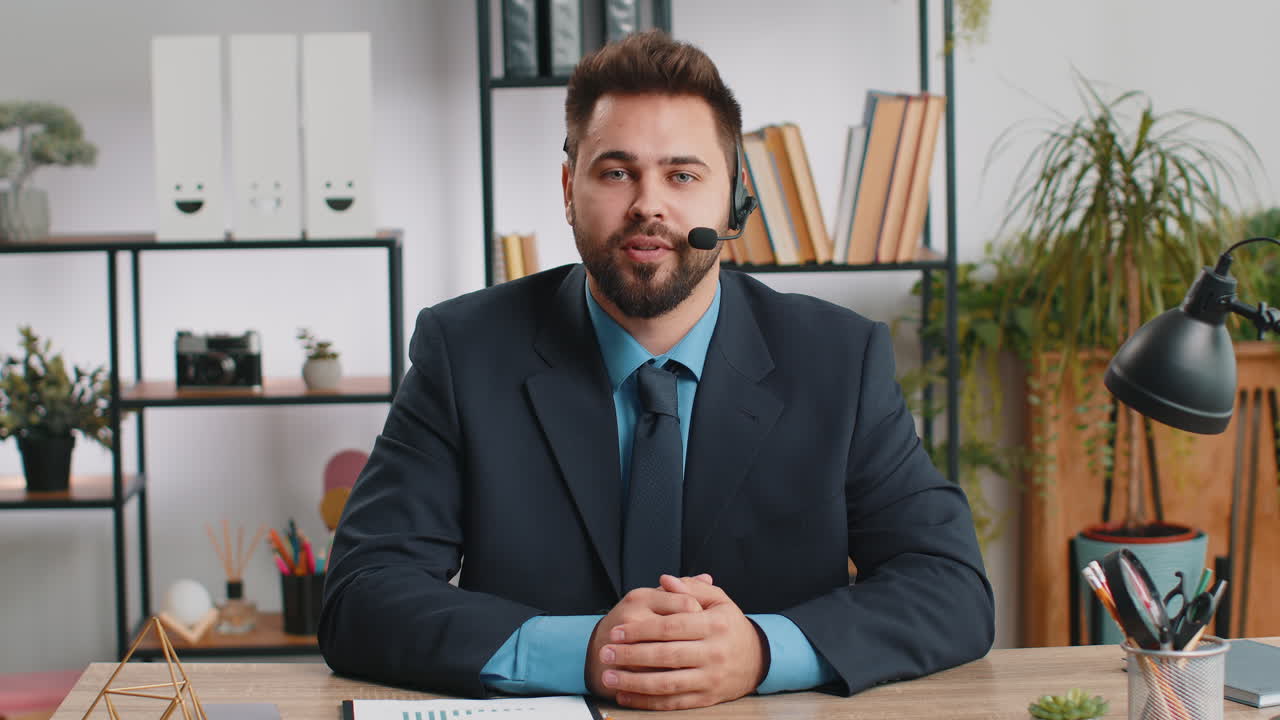 Businessman working on laptop wearing headset call center support service operator office helpline