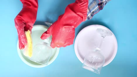 washing glasses and dishes with gloves