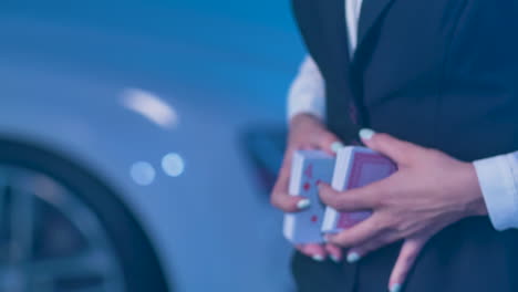 female croupier shuffles a fresh deck of cards in casino, close-up hands