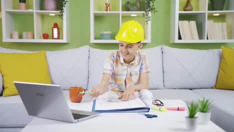 The-boy-wearing-his-father's-helmet-wants-to-be-an-engineer-like-his-father.