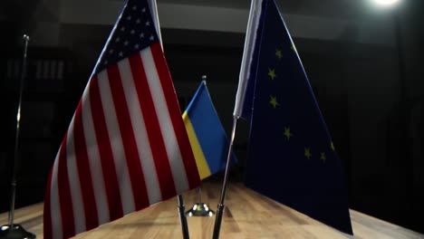 ukrainian flag on a table in a dimly lit room