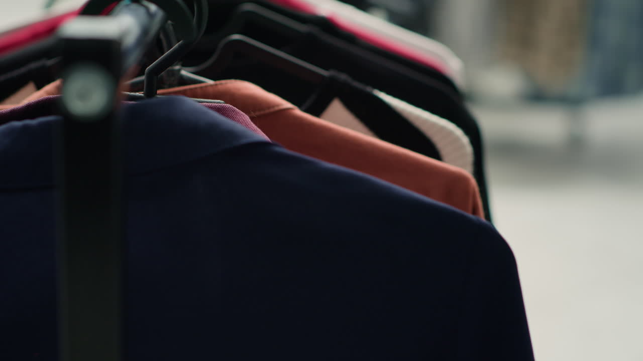 Clothes on hangers in fashion boutique